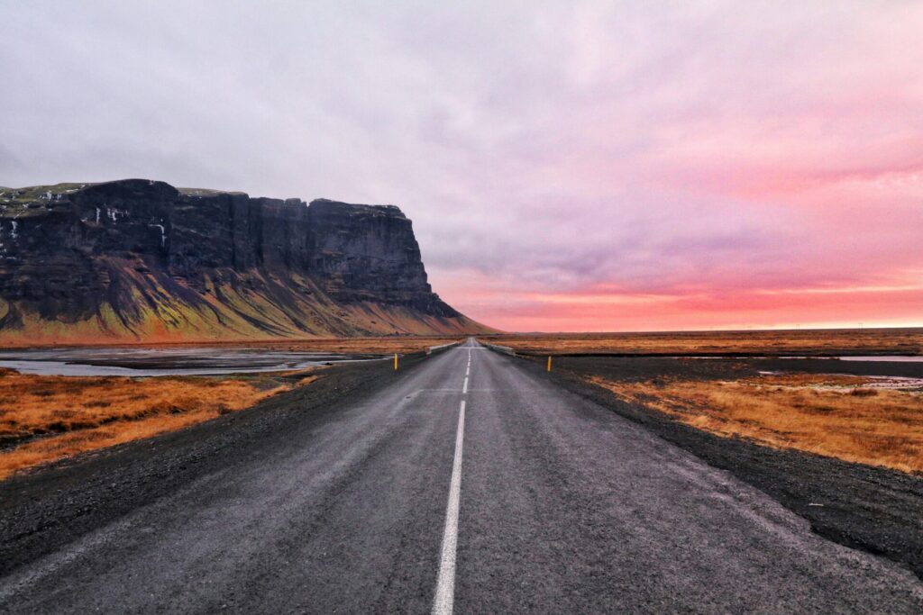 road at sunset by ocean