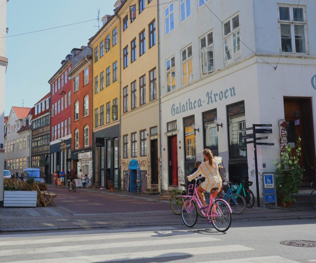 woman on bike in old city
