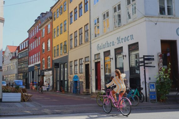 woman on bike in old city